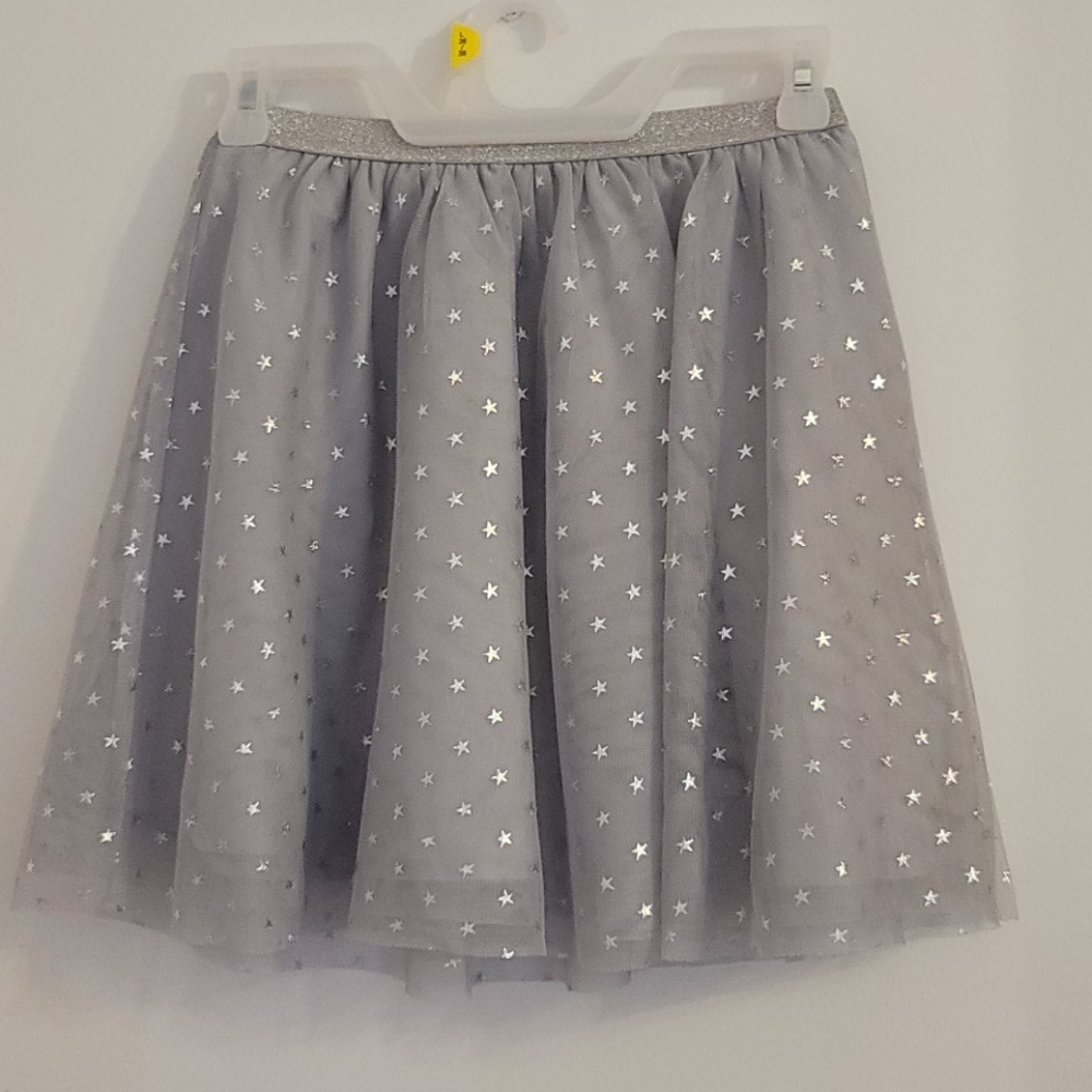 GAP girl skirt with silver shimmer stars. Size 7